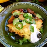 Tamale Pie with Olives, Avocado, Sour Cream, and Cilantro.